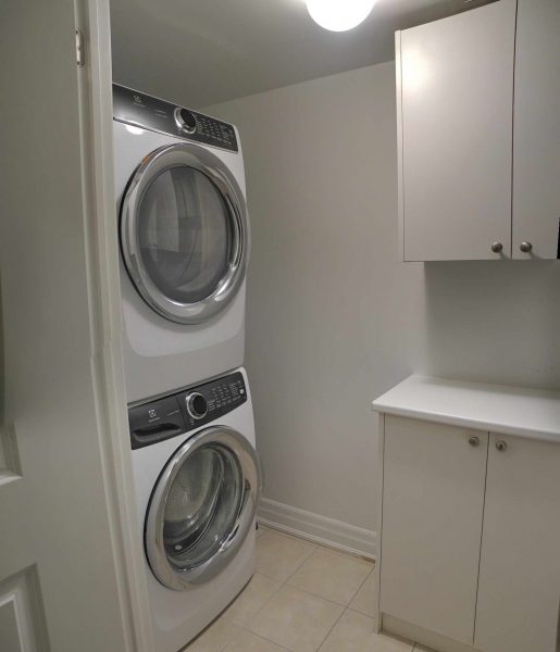 The laundry room has a full-size front-load Electrolux washer and dryer